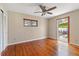 Bedroom with hardwood floors, closet and a door to the patio at 3726 Prescott N St, St Petersburg, FL 33713