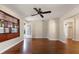 Spacious living room with gleaming hardwood floors, a ceiling fan, and natural light at 3726 Prescott N St, St Petersburg, FL 33713