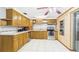 Functional kitchen with stainless steel appliances, tile flooring, and ample cabinetry space at 39233 9Th Ave, Zephyrhills, FL 33542