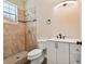 Bathroom featuring tiled shower, stylish vanity, and modern fixtures at 4205 57Th N Ave, St Petersburg, FL 33714