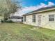Spacious backyard features a well-maintained lawn, privacy fence, and mature trees at 4262 Larkenheath Dr, Spring Hill, FL 34609