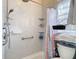 Bathroom highlighting a shower with a grab bar and tiered corner shelving at 4262 Larkenheath Dr, Spring Hill, FL 34609