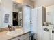 Bathroom featuring a vanity, cabinets, and a decorative mirror at 4262 Larkenheath Dr, Spring Hill, FL 34609