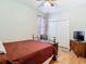 Comfortable bedroom featuring hardwood floors, a full bed, and a double-door closet at 4262 Larkenheath Dr, Spring Hill, FL 34609