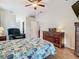 Bright bedroom with dark wood furnishings and flooring offers a relaxing retreat at 4262 Larkenheath Dr, Spring Hill, FL 34609
