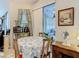 Cozy dining area with a table, chairs, and natural light streaming in from the sliding glass door at 4262 Larkenheath Dr, Spring Hill, FL 34609