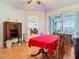 Open-concept dining room featuring hardwood floors, stylish furniture, and natural light at 4262 Larkenheath Dr, Spring Hill, FL 34609