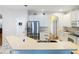Spacious kitchen with stainless steel refrigerator and plenty of natural light from the surrounding windows at 4262 Larkenheath Dr, Spring Hill, FL 34609