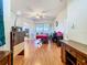 Light-filled living room with hardwood floors and sliding glass doors to the outdoor patio at 4262 Larkenheath Dr, Spring Hill, FL 34609