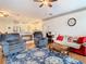 Spacious open concept living room with wood floors flows into a modern kitchen area at 4262 Larkenheath Dr, Spring Hill, FL 34609