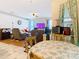 Inviting living area with hardwood floors, neutral paint, and an open layout at 4262 Larkenheath Dr, Spring Hill, FL 34609