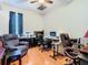 Functional office space with a ceiling fan, comfortable seating, and practical work area at 4262 Larkenheath Dr, Spring Hill, FL 34609