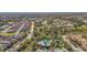 An aerial view highlights the proximity to the community pool, residences and natural beauty at 4811 Forest Creek Trl, Parrish, FL 34219
