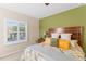 Comfortable bedroom featuring window with shutters at 4811 Forest Creek Trl, Parrish, FL 34219