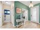Light-filled foyer with wood-look tile floors and stylish decor, showcasing the home's welcoming entrance at 4811 Forest Creek Trl, Parrish, FL 34219