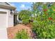 Beautiful home with lush landscaping, brick walkway, and a well-manicured lawn at 4811 Forest Creek Trl, Parrish, FL 34219