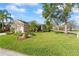 Well-maintained home with mature trees, lush lawn, and a two-car garage at 4811 Forest Creek Trl, Parrish, FL 34219