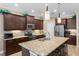 Beautiful kitchen with stainless steel appliances, granite countertops, and a large center island at 4811 Forest Creek Trl, Parrish, FL 34219