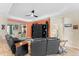 Comfortable living room offering lots of light, custom built-in shelving, and a stylish ceiling fan at 4811 Forest Creek Trl, Parrish, FL 34219