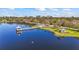 A lovely walking path surrounds a pond with a picturesque gazebo and fishing pier at 4811 Forest Creek Trl, Parrish, FL 34219