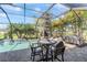 Sparkling pool surrounded by lush landscaping and a screened enclosure for year-round enjoyment at 4811 Forest Creek Trl, Parrish, FL 34219