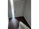 Inviting entryway featuring hardwood flooring, white front door, and crisp white trim at 500 New York Ave # 21, Dunedin, FL 34698