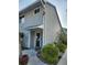 Charming two-story home showcasing new grey siding, manicured landscaping, and inviting entrance at 500 New York Ave # 21, Dunedin, FL 34698