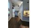 Open-concept living room with vaulted ceilings, modern light fixtures, and hardwood floors at 500 New York Ave # 21, Dunedin, FL 34698