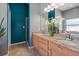Well-lit bathroom with double sinks, granite countertops, and a separate walk-in shower at 5001 44Th N Ave, St Petersburg, FL 33709