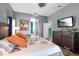 Cozy bedroom featuring a television, dresser, and access to other parts of the house at 5001 44Th N Ave, St Petersburg, FL 33709