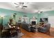 Open-concept living room featuring hardwood floors, a cozy fireplace, and stylish furnishings at 5001 44Th N Ave, St Petersburg, FL 33709