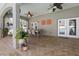 Covered patio with ceiling fans and outdoor decor, perfect for enjoying the poolside view at 5001 44Th N Ave, St Petersburg, FL 33709