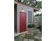 Exterior view of the home showing a private entrance with decorative brickwork and a well-maintained patio at 5670 11Th S St, St Petersburg, FL 33705