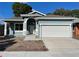 Newly constructed single-Gathering home with an attached two-car garage, and well manicured lawn on a sunny day at 5710 42Nd N St, St Petersburg, FL 33714