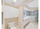 Bright bathroom featuring a white vanity, storage, and shower/tub combo at 6495 Shoreline Dr # 8105, Seminole, FL 33708