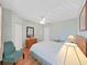 Bedroom with hardwood floors, ceiling fan, and natural light from the large windows at 6495 Shoreline Dr # 8105, Seminole, FL 33708