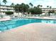 Beautiful community pool features a spacious deck area with plenty of seating for residents at 6495 Shoreline Dr # 8105, Seminole, FL 33708