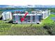 Rear aerial view showcasing the condos and highlighting private outdoor patio with waterfront views at 6495 Shoreline Dr # 8105, Seminole, FL 33708