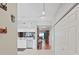 Inviting condo foyer leading to a kitchen and a living room with light walls and tile flooring at 6495 Shoreline Dr # 8105, Seminole, FL 33708