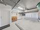 Large garage with room for parking, storage and featuring white cabinets at 6495 Shoreline Dr # 8105, Seminole, FL 33708