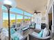 Serene lanai with comfortable seating, scenic views, and an inviting atmosphere for outdoor enjoyment at 6495 Shoreline Dr # 8105, Seminole, FL 33708