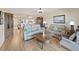 Inviting living room with hardwood floors, comfortable seating, and seamless access to the dining area at 6495 Shoreline Dr # 8105, Seminole, FL 33708