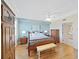 Serene main bedroom boasts natural light, warm hardwood floors, and a comfortable king-size bed at 6495 Shoreline Dr # 8105, Seminole, FL 33708