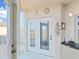 Sunroom entrance with double doors and windows that offer stunning views of the surrounding area at 6495 Shoreline Dr # 8105, Seminole, FL 33708