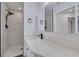 Updated bathroom featuring a walk-in shower, modern vanity, and sleek fixtures at 6672 56Th N Ave, St Petersburg, FL 33709
