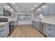Renovated kitchen with gray cabinetry, stainless steel appliances, and modern countertops at 6672 56Th N Ave, St Petersburg, FL 33709