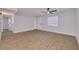 Inviting living room with wood-look flooring, a ceiling fan, and a bright window at 6672 56Th N Ave, St Petersburg, FL 33709
