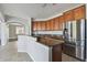 Kitchen featuring granite countertops, stainless steel appliances, and ample cabinet space at 6816 Guilford Bridge Dr, Apollo Beach, FL 33572