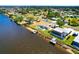 Beautiful aerial view of waterfront homes with screened lanais and private docks enhancing the coastal lifestyle at 7094 Kenwood Dr, North Port, FL 34287