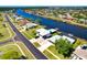 Aerial view of waterfront community with private docks, offering scenic views and convenient boating access at 7094 Kenwood Dr, North Port, FL 34287